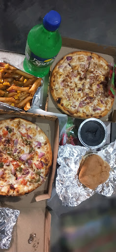 Pizzas, fries and a cold drink
